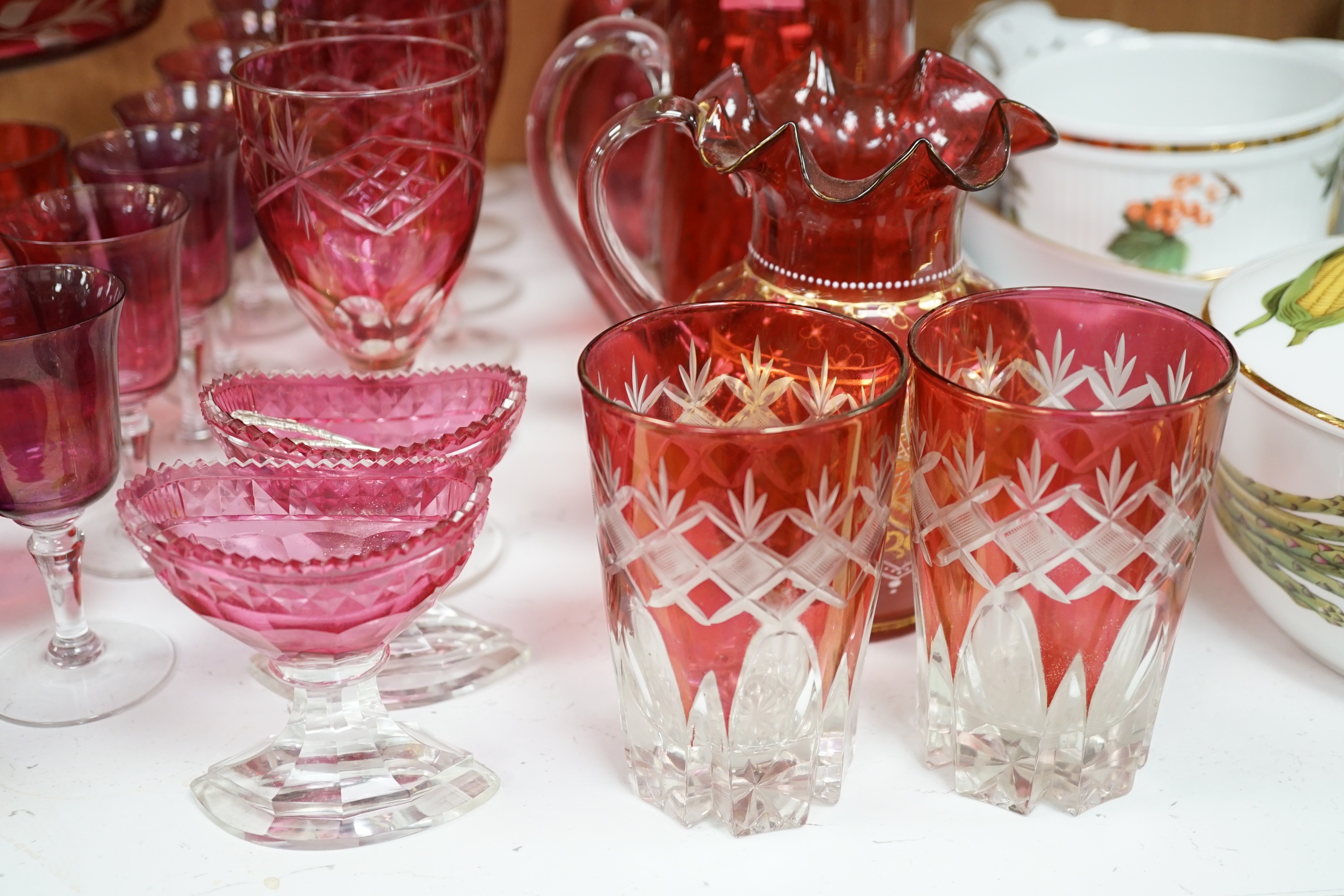 Red glasswares and six various cranberry coloured glass jugs, etc. 19th/early 20th century